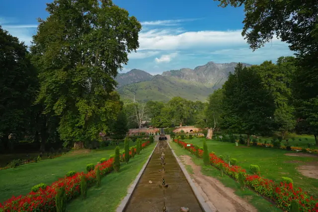 The central water channel and flower beds of Nishat Bagh below the Zabarwan hills