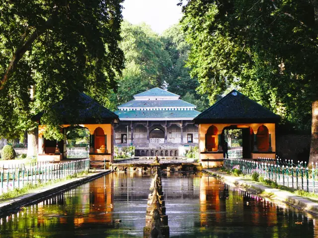 A pavilion reflected in the canal at Shalimar Bagh, Srinagar