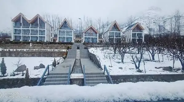 Chalet-style cottages of Hotel Rah Bagh in the snow