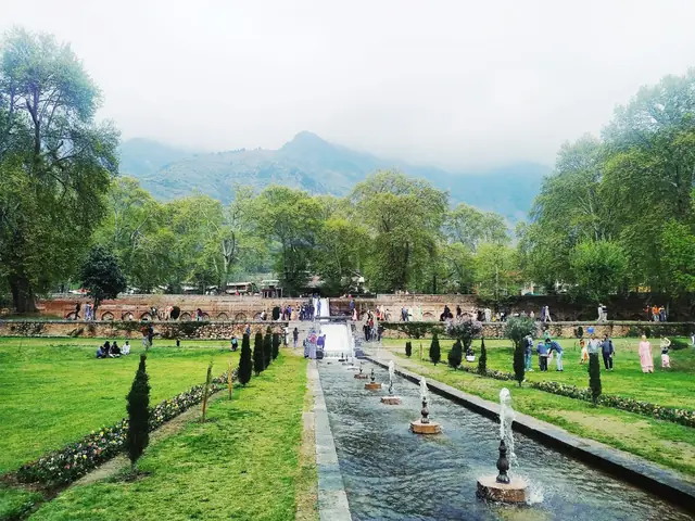 Fountains and a water channel running through a Mughal garden in Srinagar
