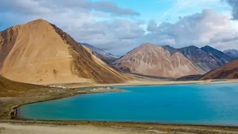 The blue expanse of Pangong Tso between bare Ladakh mountains